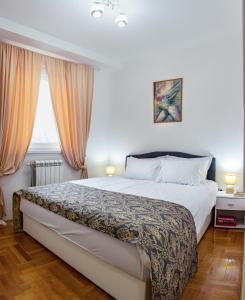 Postel nebo postele na pokoji v ubytování Apartman Mia