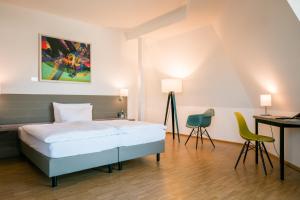 Postel nebo postele na pokoji v ubytování Hotel Trezor