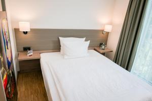 Postel nebo postele na pokoji v ubytování Hotel Trezor