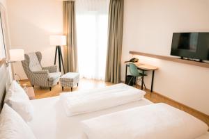 Postel nebo postele na pokoji v ubytování Hotel Trezor