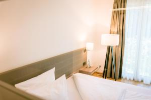 Postel nebo postele na pokoji v ubytování Hotel Trezor