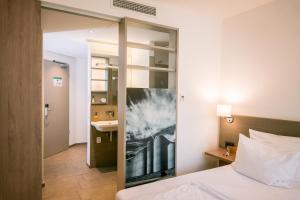 Postel nebo postele na pokoji v ubytování Hotel Trezor