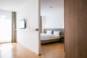 Postel nebo postele na pokoji v ubytování Hotel Trezor