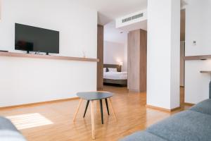 TV a/nebo společenská místnost v ubytování Hotel Trezor
