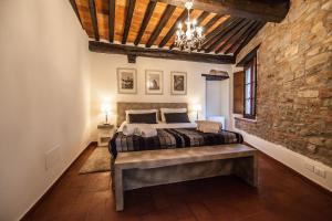 Ένα ή περισσότερα κρεβάτια σε δωμάτιο στο Accogliente Appartamento sulle Colline Toscane