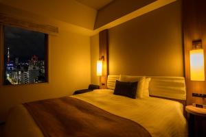 Postel nebo postele na pokoji v ubytování Tokyu Stay Ginza