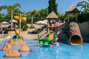 a water park with a slide in the water at Camping Tucan - Mobile Homes by Lifestyle Holidays in Lloret de Mar