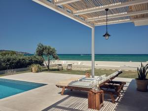 The swimming pool at or close to Astarte Villas - Onda Del Mar Beach Villa