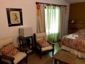 Postel nebo postele na pokoji v ubytování Hotel Complejo Najul Suites-Solo Adultos