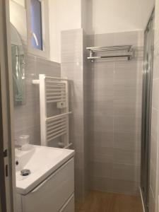 a bathroom with a white sink and a shower at 6 rue de la tourraque in Antibes