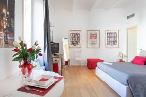 Ένα ή περισσότερα κρεβάτια σε δωμάτιο στο Nostromondo Ciancaleoni Palace