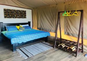 Cama o camas de una habitación en Oldonyo Orok Lodge