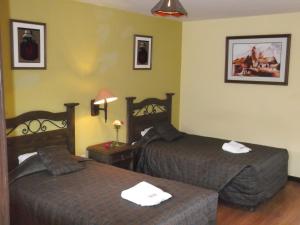 Cama o camas de una habitación en La Posada del Conde Lodge