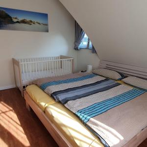 Postel nebo postele na pokoji v ubytování Reethaus-Carpe-Diem