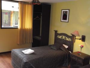 Cama o camas de una habitación en La Posada del Conde Lodge