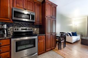 a kitchen with a stove and a microwave at Elkhorn Angani 54 in Sun Valley