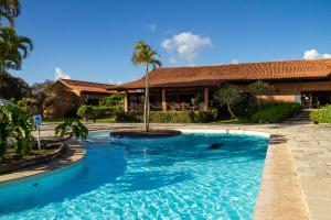 a swimming pool in front of a house at Hotel Casa Grande Gravatá in Gravatá +108 photos