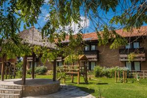 a house with a playground in front of it at Hotel Casa Grande Gravatá in Gravatá
