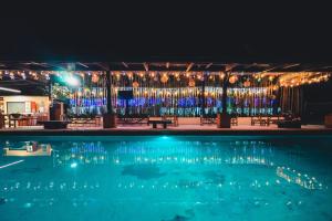 a swimming pool at night with christmas lights at Hotel Quinta Moctezuma in Oaxtepec