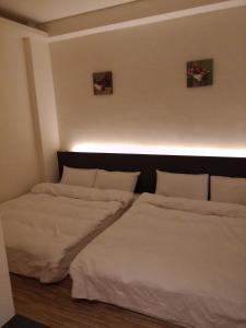 Postel nebo postele na pokoji v ubytování Tilon Hotel