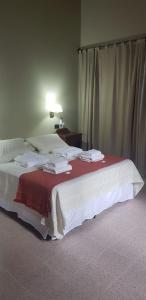 Una cama o camas en una habitación de Torres de la Quebrada