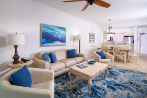 a living room with a couch and a table at Bellasera Resort in Naples