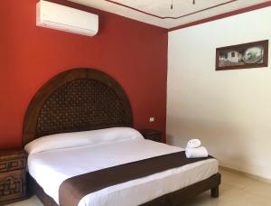 Ένα ή περισσότερα κρεβάτια σε δωμάτιο στο Hotel Tuul