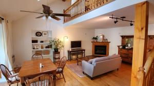 a living room with a couch and a table at Rosemount Inn in Kingston