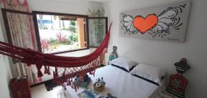 Un pat sau paturi într-o cameră la Loft-Atelier 100m praia