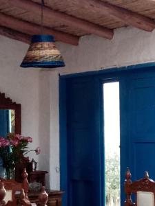 a blue room with a blue door and a blue ceiling at Estancia El Sol in Sogamoso