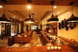 a kitchen with a bunch of pots and pans at Hotel Middle Path & Spa in Pokhara