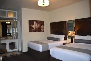 Voodi või voodid majutusasutuse Hotel Frontiere Tijuana toas
