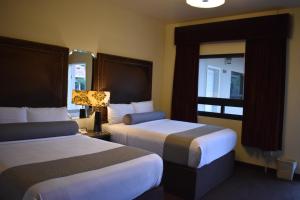 Voodi või voodid majutusasutuse Hotel Frontiere Tijuana toas