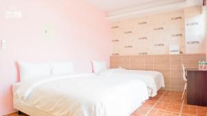 Postel nebo postele na pokoji v ubytování 金門微醺民宿 Kinmen TipsyHotel B&B