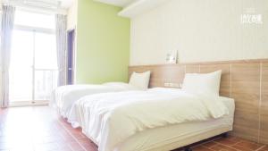 Postel nebo postele na pokoji v ubytování 金門微醺民宿 Kinmen TipsyHotel B&B