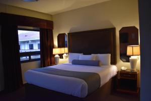 Voodi või voodid majutusasutuse Hotel Frontiere Tijuana toas