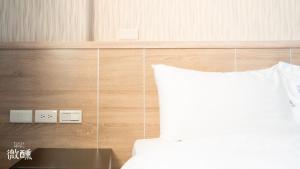 Postel nebo postele na pokoji v ubytování 金門微醺民宿 Kinmen TipsyHotel B&B