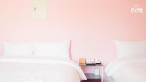 Postel nebo postele na pokoji v ubytování 金門微醺民宿 Kinmen TipsyHotel B&B