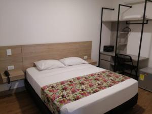 Krevet ili kreveti u jedinici u okviru objekta Hotel Poma Rosa