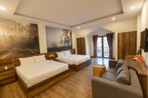 Postel nebo postele na pokoji v ubytování Lien's Hotel Đà Lạt + 17 fotografií