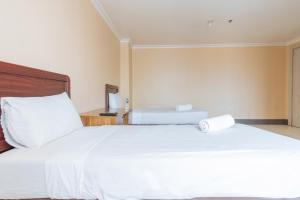 מיטה או מיטות בחדר ב-Dechmark Hotel