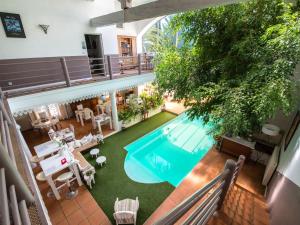 an overhead view of a swimming pool in a building at Chambre d'Hôtes Villa Ambrosia in Narbonne