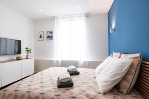 Een bed of bedden in een kamer bij La véranda