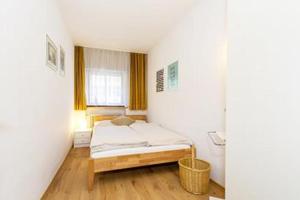 Кровать или кровати в номере Ferienwohnung Kothen