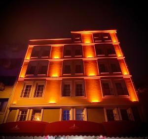 a building with lights on top of it at night at Galata Hill Hotel in Istanbul