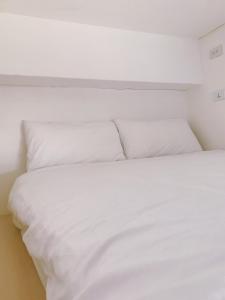 Cama o camas de una habitación en PlainStay Hostel