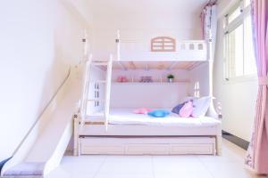 Een bed of bedden in een kamer bij 林居民宿