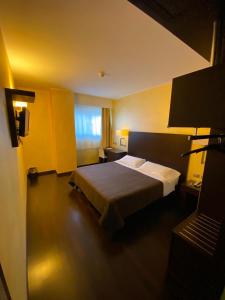 Letto o letti in una camera di E' Hotel