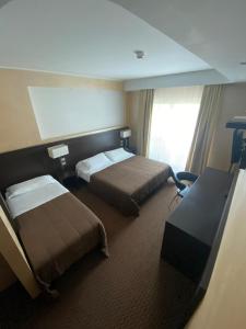 Letto o letti in una camera di E' Hotel