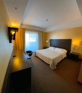Letto o letti in una camera di E' Hotel